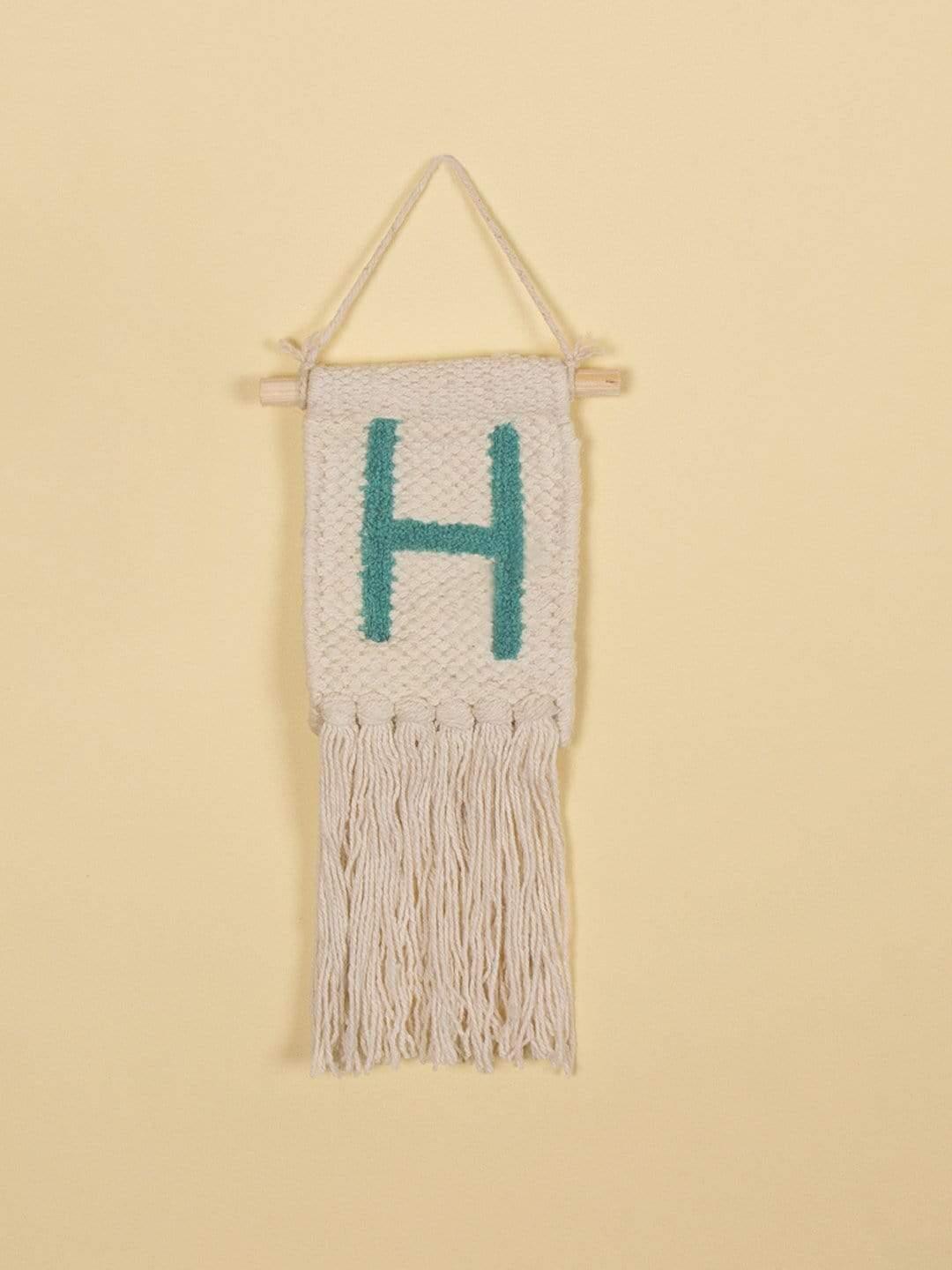Monogram Mini Wall HangingMaterial: Cotton
Dimensions: 4L inch x 10H inch.
Note: The Alphabet letter embroidery is made of recycled thread the color will vary as per the availability.

The ImMonogram Mini Wall HangingThe Wishing Chair