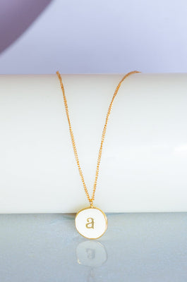 Photoframes & jewellery boxes A Monogram Pendant with Necklace