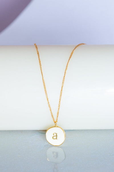 Photoframes & jewellery boxes A Monogram Pendant with Necklace