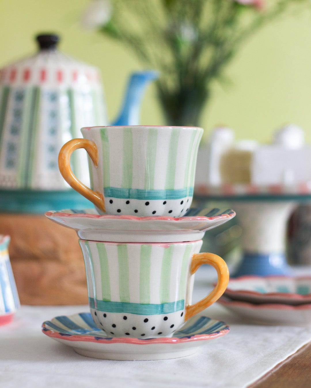 Masquerade handpainted ceramic teacups and saucers, set of 2, in pastel stripes | The Wishing Chair