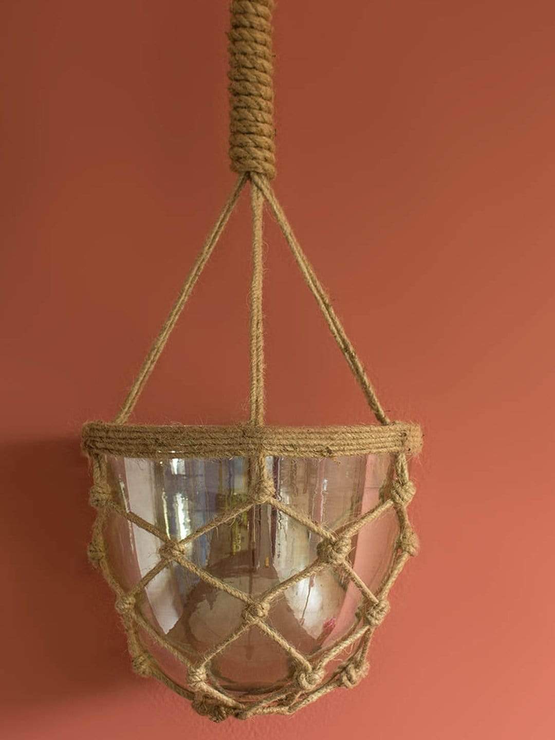 Luster Hanging Planter With Knotted RopeMaterial: Glass &amp; Jute Rope
Dimensions: 6.25 Dia x 7.25 H Inch



 Luster Hanging PlanterThe Wishing Chair