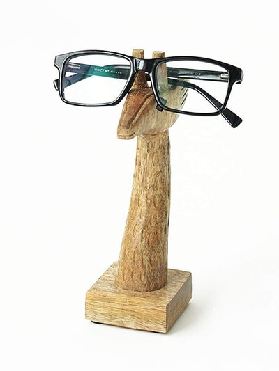 Mr. Giraffe Glasses Holder
ABOUT:
Animal lovers – this one’s for you, and we can’t believe it’s taken us this long to get here, TBH. A glass stand that’s shaped like a giraffe for your desk –Giraffe Glasses Holder