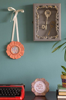  Triad Hanging Photoframe - FlowerMaterial: MANGO WOOD / MDF & GLASS
Dimensions: Dia 14 cms

Do not wash, Use a slightly damp cloth to clean. Wipe dry. Avoid dragging sharp or rough objects acrosTriad Hanging Photoframe - FlowerThe Wishing Chair - Triad Hanging Photoframe - Flower - The Wishing Chair 