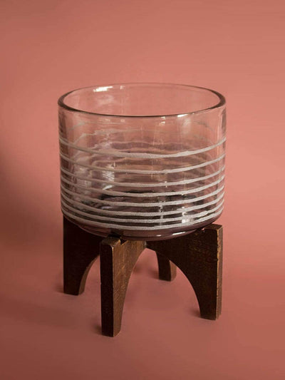 Luster Votive With Wooden Stand - LargeMaterial: Glass &amp; Wood
Dimensions: 6.5 Dia x 8.25 H Inch

Handle with care. May chip or break on impact. Do not wash. Avoid dragging sharp or rough objects acrosWooden Stand - LargeThe Wishing Chair