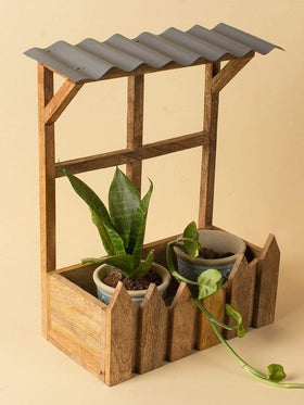  Wooden Hut Planter HolderMaterial: Wood & Aluminium
Dimensions: 8.9 L Inchx 4.9 W Inchx 12 H Inch

Always wipe up moisture promptly and dry with a soft cloth. Avoid dragging sharp or rouWooden Hut Planter HolderThe Wishing Chair - Wooden Hut Planter Holder - The Wishing Chair 